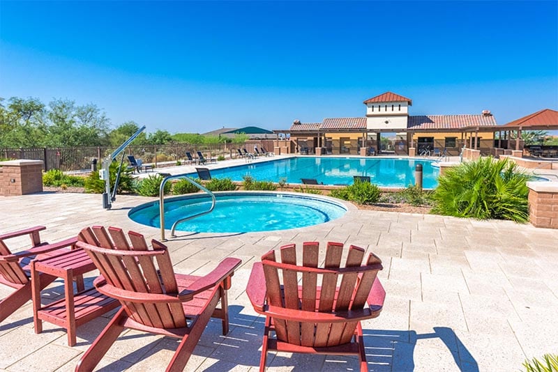 Patio chairs and a pool in the Rancho Vistoso MPC of Arizona