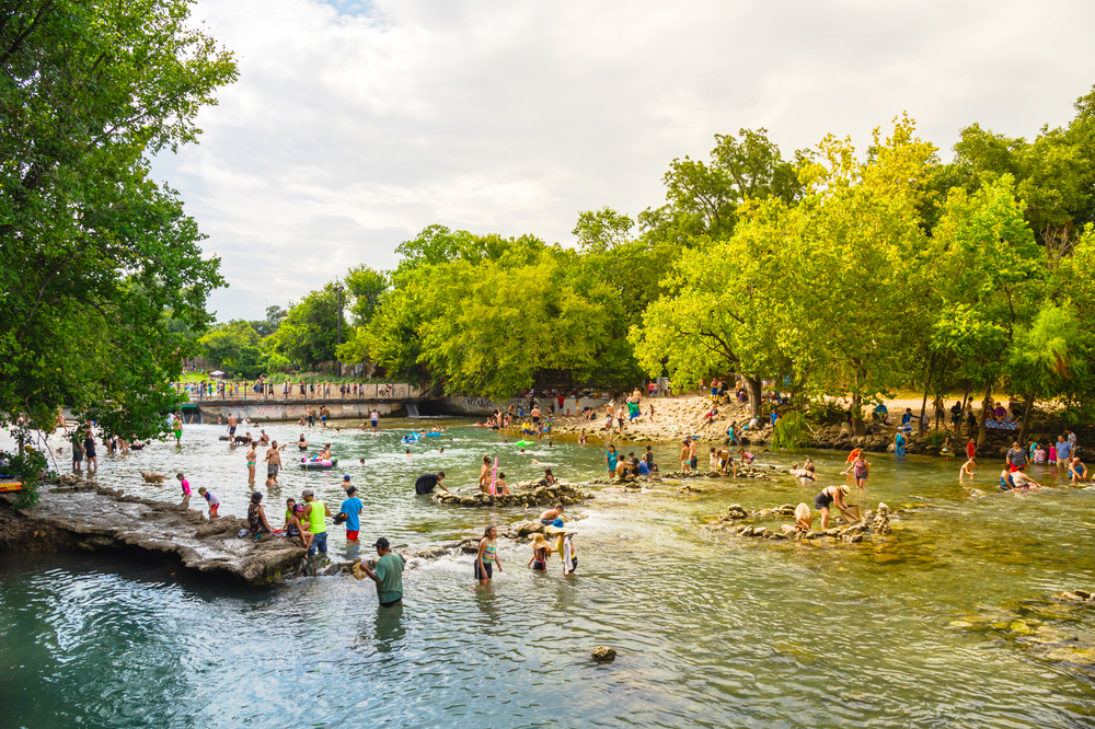 People swimming at Barton Creek Springs in Austin, Texas