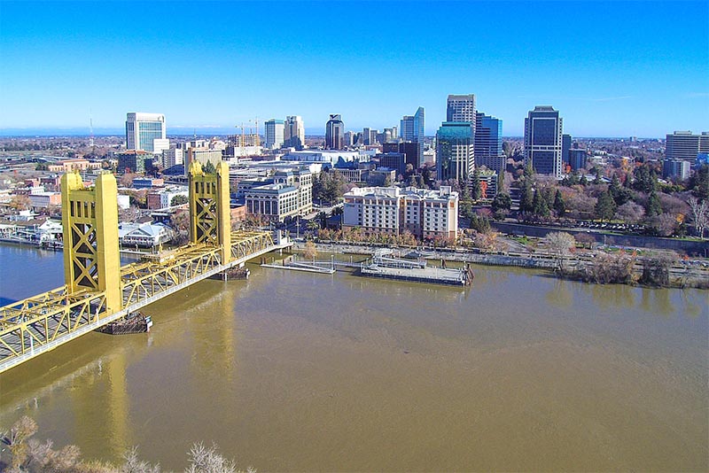 An aerial view of Sacramento with a view of the river and the skyline