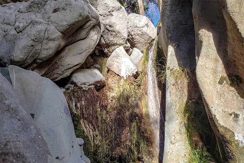 Santa Ynez Falls, tucked into a cove with just a bit of water falling onto the rocks