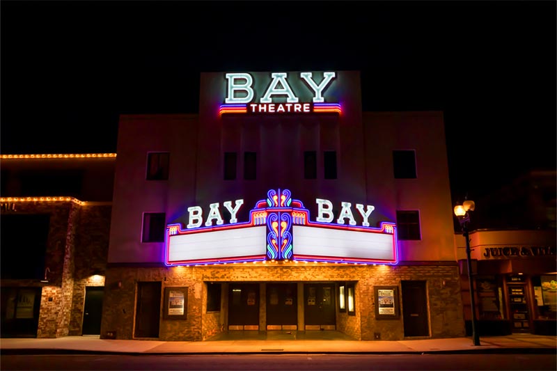 Exterior view of the iconic Bay Theater at night in Seal Beach, California
