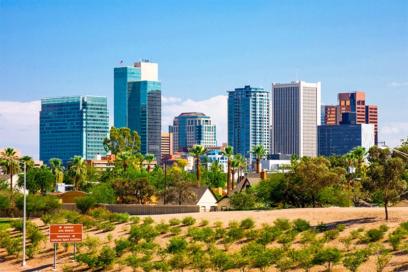 Downtown Phoenix Arizona with tall buildings as seen from a highway