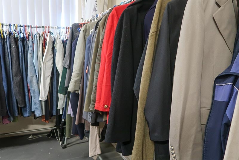 Clothing on racks at a thrift store