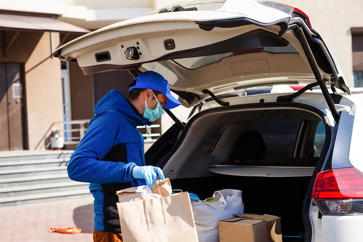 Delivery man in protective mask