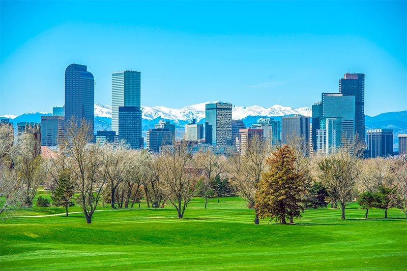 The downtown Denver skyline as seen from a park