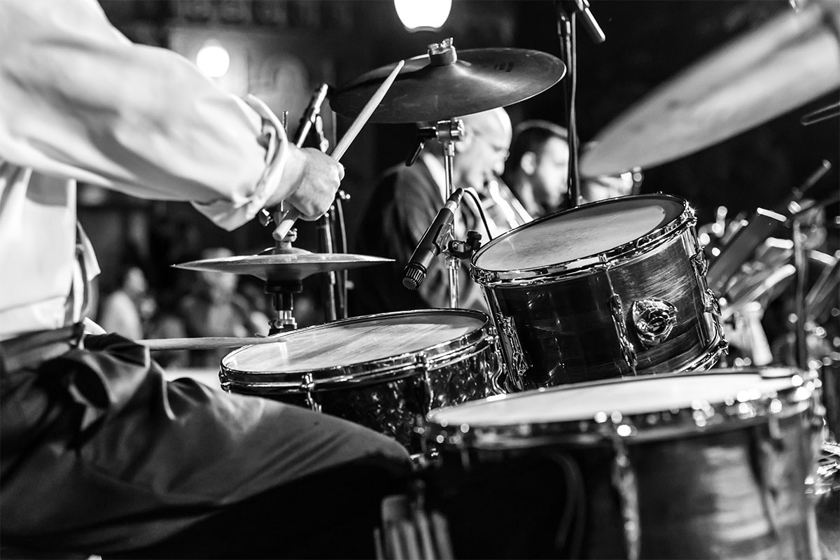 Drummer playing at show 