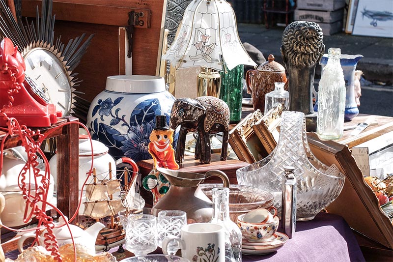 A collection of antiques all densely collected on a table