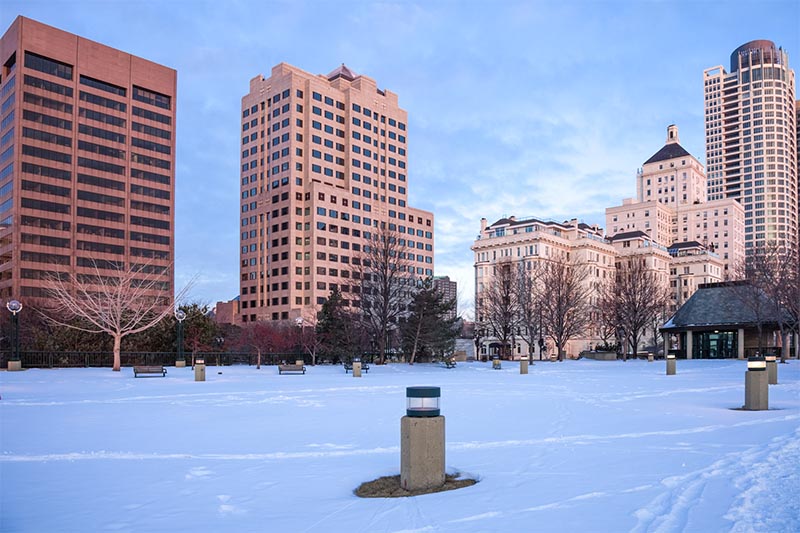 Milwaukee high rises during snowy winter as seen from a walking path