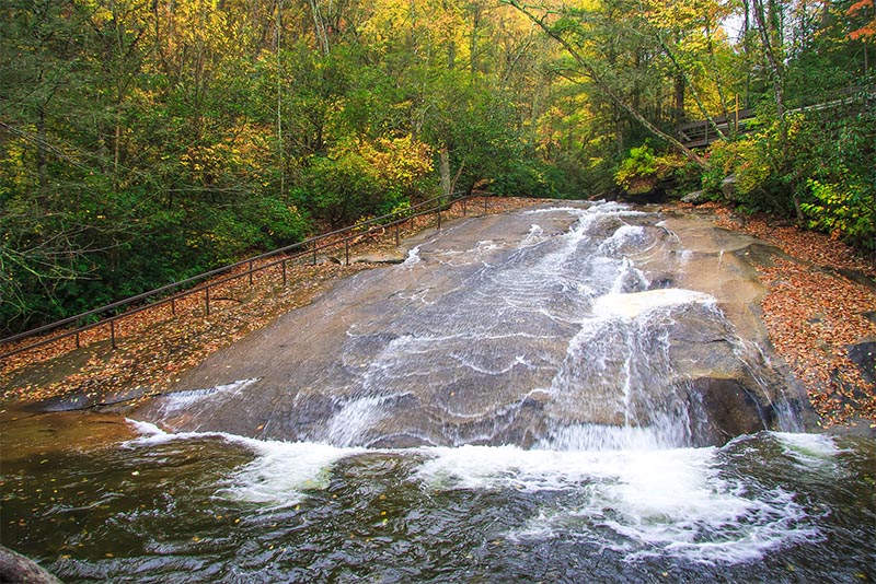 A naturally flat rock face creates a water slide waterfall in the Charlotte area