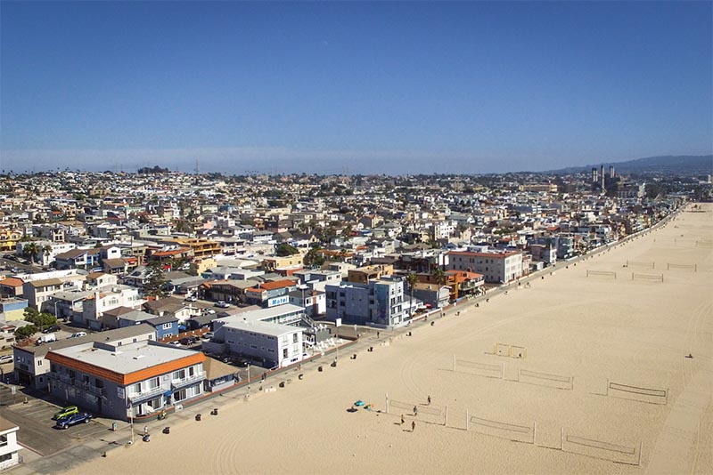 The Strand line of beach and buildings in Hermosa Beach Los Angeles