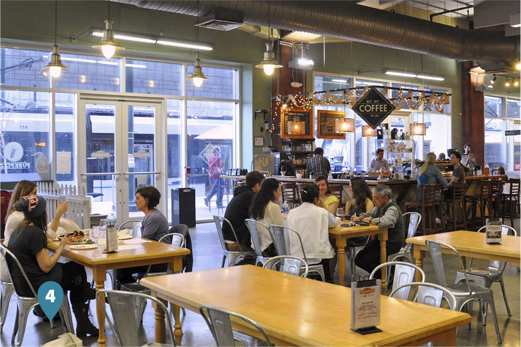Customers sitting and eating at the 7th Street Public Market in Charlotte, North Carolina
